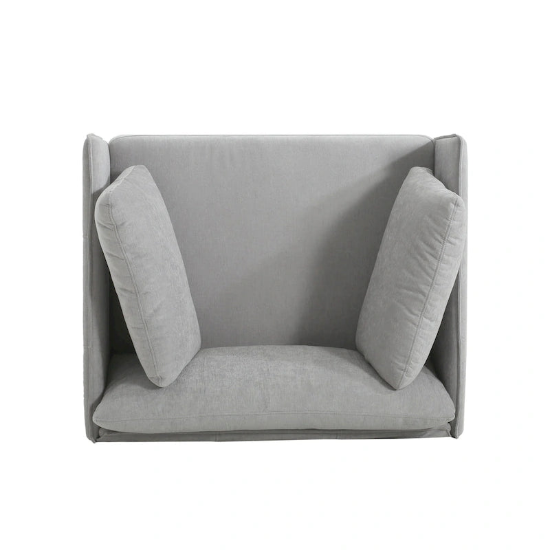 Moderner gepolsterter Loungesessel mit Metallbeinen und Kissen