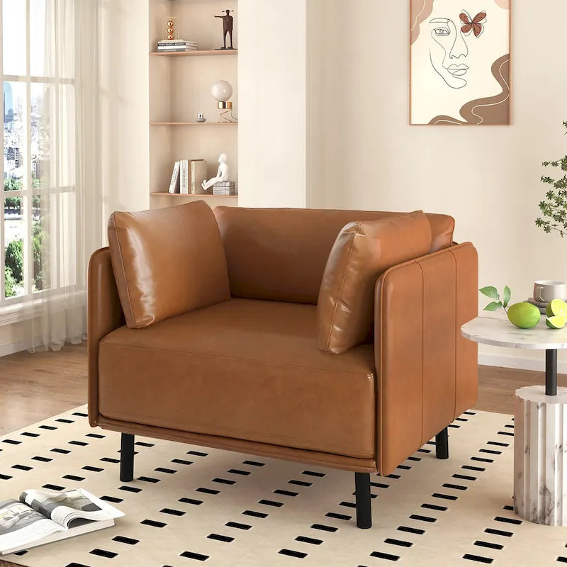 Moderner gepolsterter Loungesessel mit Metallbeinen und Kissen