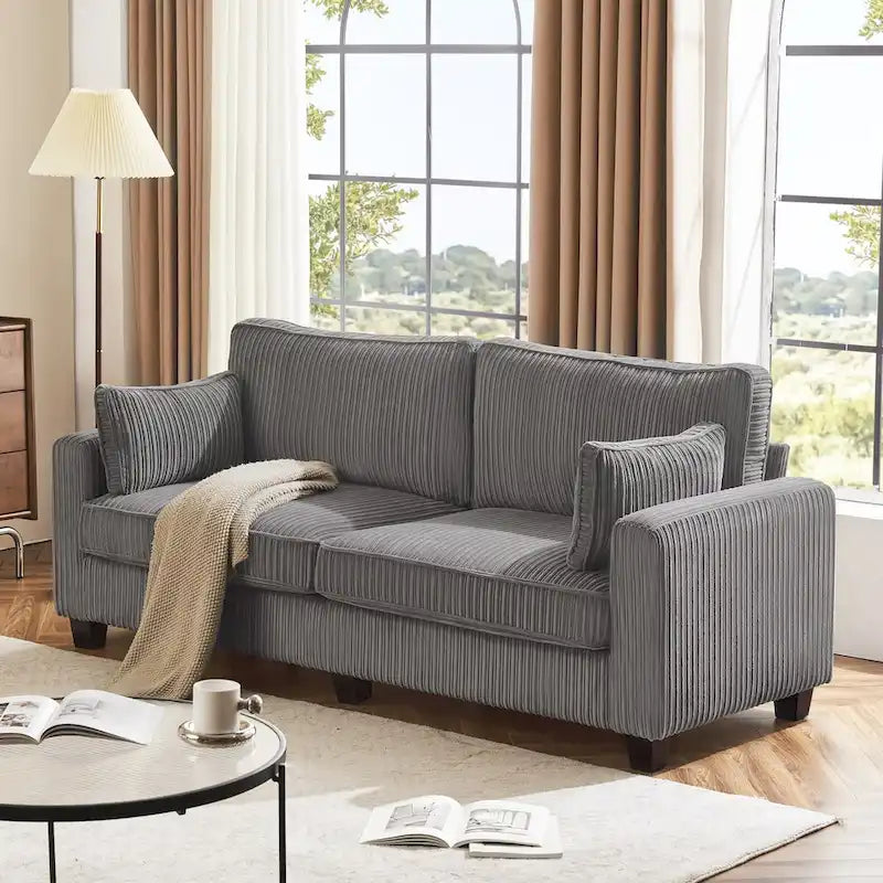 Modernes Cordsofa für drei Personen mit gerollten Armlehnen und abnehmbaren Kissen