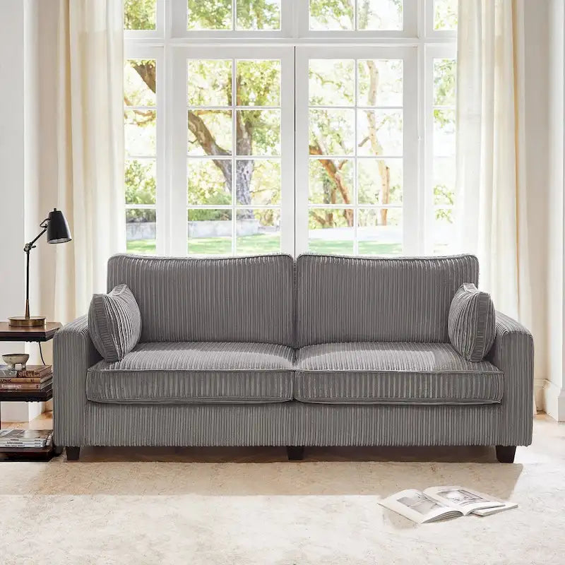 Modernes Cordsofa für drei Personen mit gerollten Armlehnen und abnehmbaren Kissen